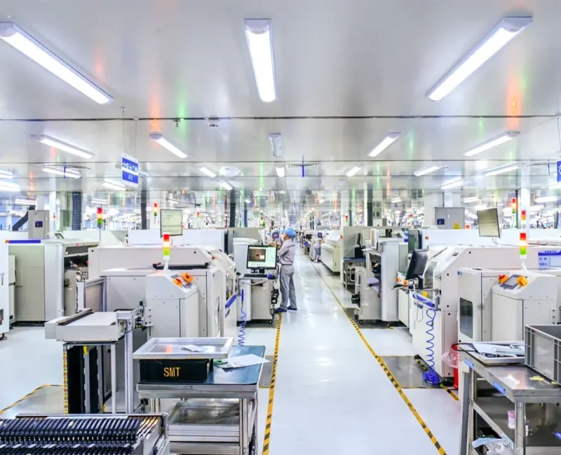 Front view of factory production line showing equipment and conveyor